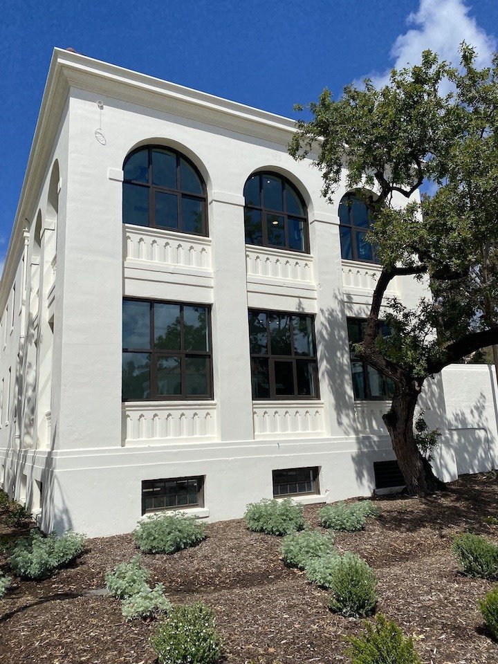 Close of view of north wing of Building 205 showing rehabilitated exterior, new windows and landscaping 